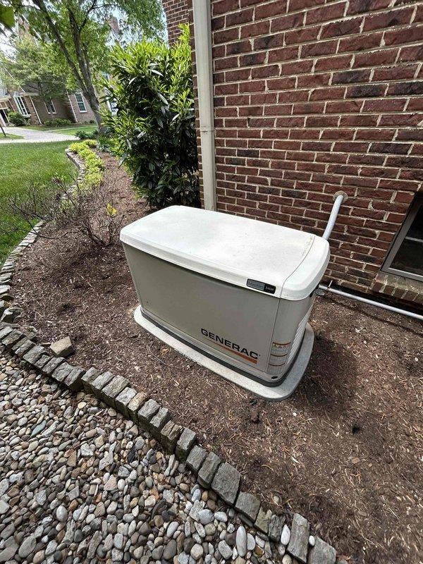 Completed scheduled maintenance on Generac Evolution 2.0 standby generator with 65.5 run hours. Performed routine inspection of unit and transfer switch, applied required maintenance stickers to both generator and transfer switch as specified, verified control panel functionality with AUTO/MANUAL/OFF modes operational, and documented equipment condition with photos while customer was available by phone for coordination.