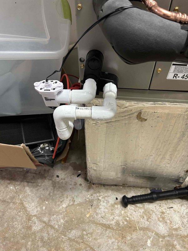 Completed full HVAC system installation in upper right hallway closet location, including Bryant 2-ton 14.3 SEER2 heat pump model GH5SAN52400A, Bryant air handler model FJ5ANXB24L00, and Bryant 8KW heat kit model TU-EC-08BKB. Utilized existing outdoor unit pad with snow legs for proper equipment support and drainage. Installed electrical whip kit and disconnect box for code-compliant power supply to outdoor unit. Ran and insulated refrigerant lines with inline filter between outdoor heat pump and indoor air handler. Configured air handler with proper trap installation and SS2 coil drain safety water sensor for condensate management. Transitioned air handler to existing ductwork system and installed standard-sized air filter rack for maintenance accessibility. Retained existing thermostat for system control. Removed and disposed of old equipment per regulations. Obtained applicable permits and completed installation to code compliance standards. System tested and operational with 10-yea