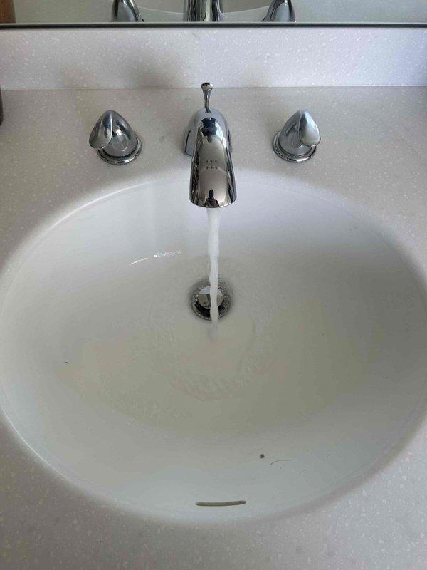 Responded to plumbing service call addressing multiple fixture issues across two bathrooms. Replaced worn washers and cartridges on three bathroom sink faucets—two in the master bathroom and one in the upstairs bathroom—to resolve active dripping and prevent future leaks. Disassembled faucet assemblies, removed deteriorated rubber washers and O-rings, and installed new replacement components to restore proper seal integrity. Assessed toilet in upstairs bathroom for slow drain condition. Tested all repaired fixtures for proper water flow and verified complete leak elimination upon completion.