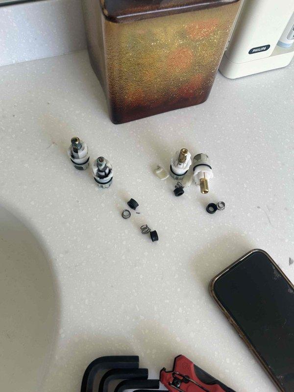 Responded to plumbing service call addressing multiple fixture issues across two bathrooms. Replaced worn washers and cartridges on three bathroom sink faucets—two in the master bathroom and one in the upstairs bathroom—to resolve active dripping and prevent future leaks. Disassembled faucet assemblies, removed deteriorated rubber washers and O-rings, and installed new replacement components to restore proper seal integrity. Assessed toilet in upstairs bathroom for slow drain condition. Tested all repaired fixtures for proper water flow and verified complete leak elimination upon completion.