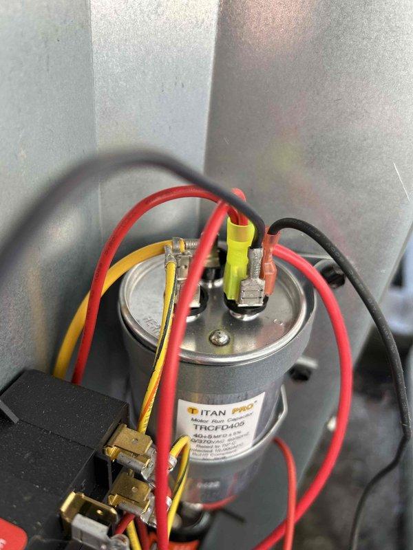 Completed Care Plan tune-up on air conditioning unit with gas furnace located in crawlspace. Performed comprehensive electrical diagnostics including capacitor testing, which measured within acceptable range at 50.02 microfarads on the Titan Pro TRCFD405 dual run capacitor. Inspected all electrical connections, contactors, and wiring integrity throughout the system. Verified proper operation of all components and connections to ensure optimal system performance for the cooling season.