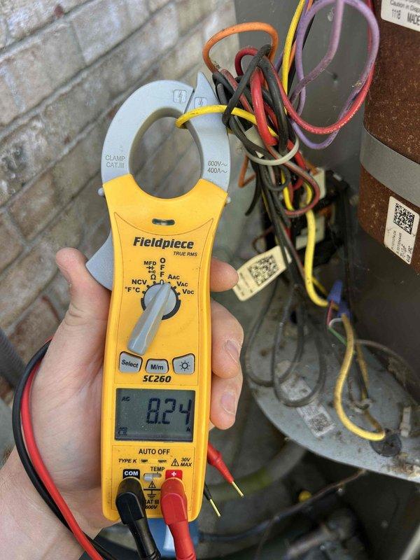 Completed annual AC tune-up on 10-year-old air conditioning system with air handler and gas furnace located in crawlspace. Performed comprehensive maintenance inspection, verified system operation with amp draw reading of 8.24 amps on compressor, checked all electrical connections and controls, and documented equipment condition through photos. Customer will supply 20x25x2 filter for ongoing maintenance.