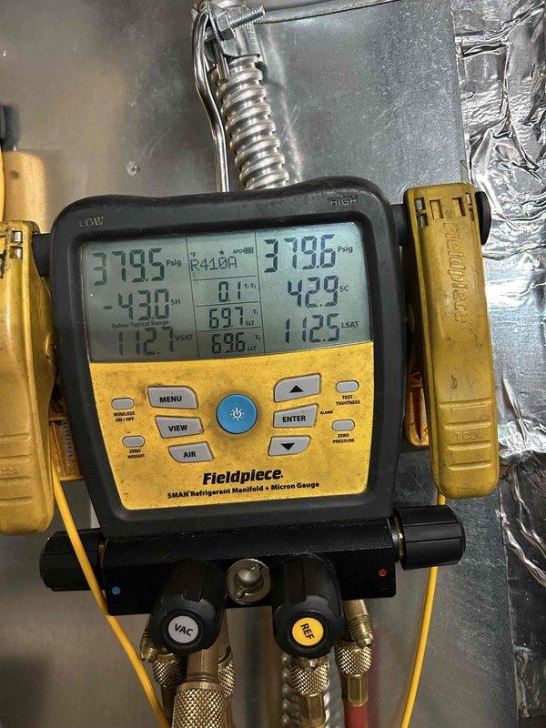 Replaced thermostatic expansion valve (TXV) on geothermal heat pump unit. Utilized refrigerant manifold gauge set to verify system pressures and temperatures on R410A refrigerant circuit, with readings indicating proper superheat and subcooling values post-repair. Unit tested and operational upon completion, with replacement part noted as backordered with extended lead time for future reference.