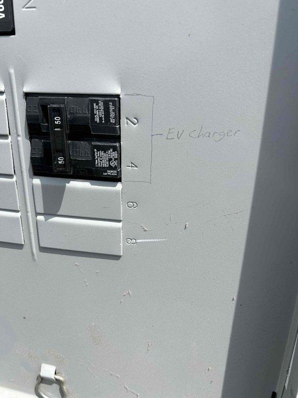 Completed generator hookup for existing transfer switch system previously installed during home construction. Connected generator to transfer switch using appropriate conduit and generator cable, installed new genpad, and connected battery to ensure proper operation. Successfully installed 240V 50-amp NEMA 14-50 receptacle for EV charging on dedicated circuit breaker #4. Verified proper amperage rating, secured all connections, and labeled electrical panel accordingly for future reference.