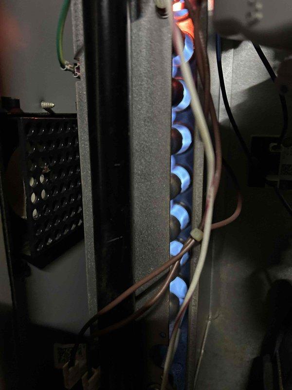 Completed comprehensive spring tune-up on 12-year-old air conditioning system. Performed full system inspection including electrical testing with digital multimeter, verified proper amperage draws, inspected and tested furnace burner assembly confirming clean blue flame combustion pattern, checked all electrical connections, tested thermostat operation, and evaluated overall system performance. Customer provided their own filter for replacement. All components operating within normal parameters with no deficiencies noted at time of service.