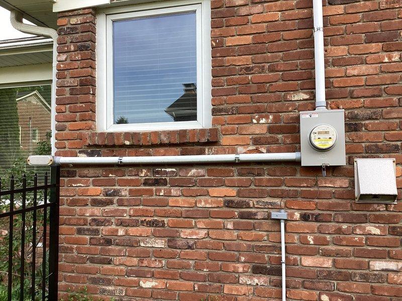 Conducted comprehensive electrical site assessment for residential standby generator installation. Evaluated existing electrical service, meter location, and available exterior wall space for transfer switch and generator placement. Documented current electrical infrastructure including service entrance, meter housing, and conduit routing to determine optimal connection points and ensure compliance with local electrical codes for emergency backup power system integration.
