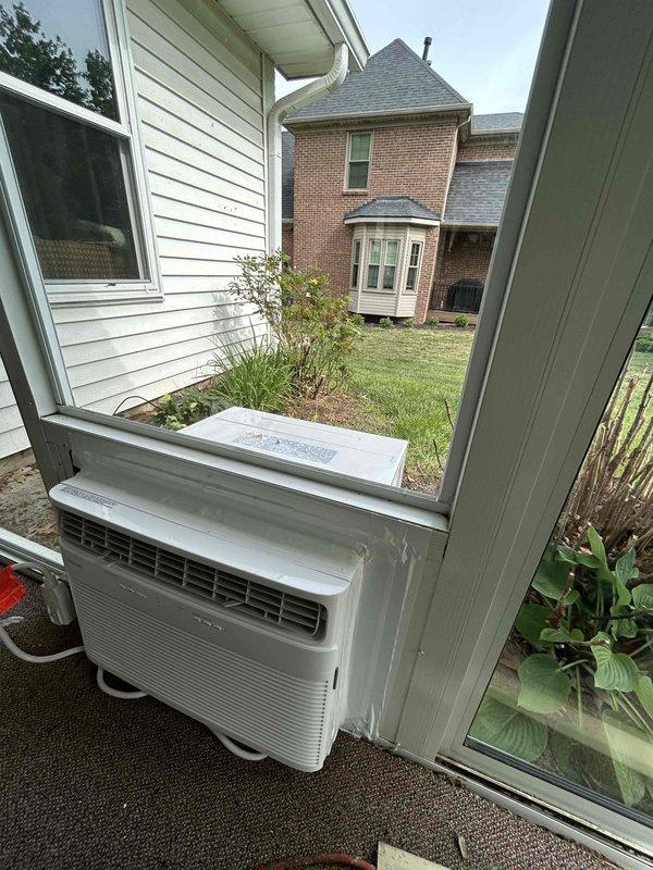 Completed installation of Frigidaire 18K BTU AC/Heat Window Unit model FHWH184WB2 in residential window opening. Unit was properly mounted, sealed, and secured with exhaust venting configured through window panel insert, then tested for proper heating and cooling operation. Installation includes one-year parts and labor warranty coverage.