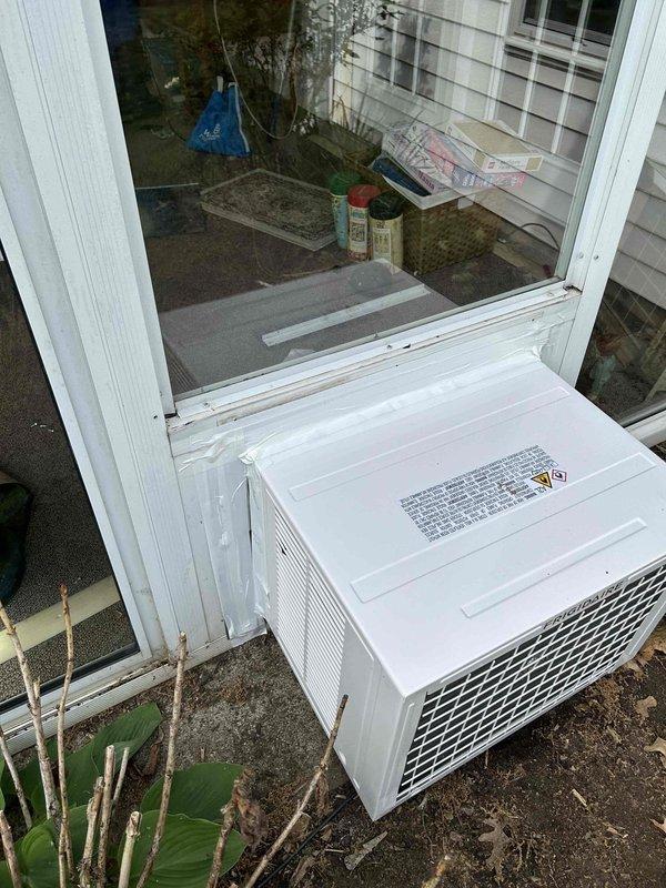 Completed installation of Frigidaire 18K BTU AC/Heat Window Unit model FHWH184WB2 in residential window opening. Unit was properly mounted, sealed, and secured with exhaust venting configured through window panel insert, then tested for proper heating and cooling operation. Installation includes one-year parts and labor warranty coverage.