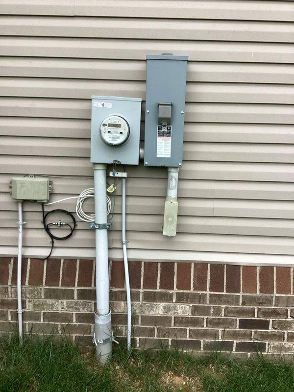 Conducted electrical estimate for panel expansion and 150-foot electrical run from existing service panel to poolside deck area to supply power for gazebo, automatic pool cover, and pool heater. Assessed current 200-amp residential electrical service panel mounted on exterior wall with adequate capacity for additional circuits. Evaluated crawl space routing for underground conduit run, noting accessible path through foundation area with proper clearances from HVAC ductwork and structural supports for code-compliant installation.