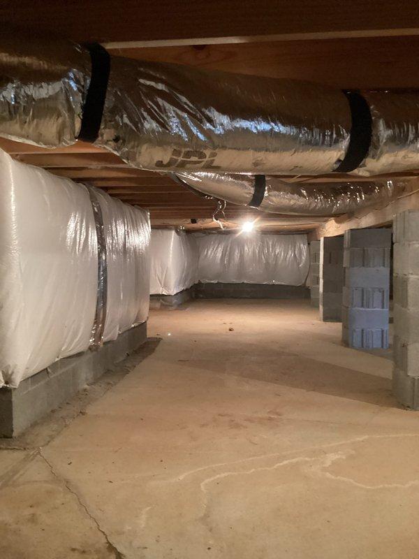 Conducted electrical estimate for panel expansion and 150-foot electrical run from existing service panel to poolside deck area to supply power for gazebo, automatic pool cover, and pool heater. Assessed current 200-amp residential electrical service panel mounted on exterior wall with adequate capacity for additional circuits. Evaluated crawl space routing for underground conduit run, noting accessible path through foundation area with proper clearances from HVAC ductwork and structural supports for code-compliant installation.