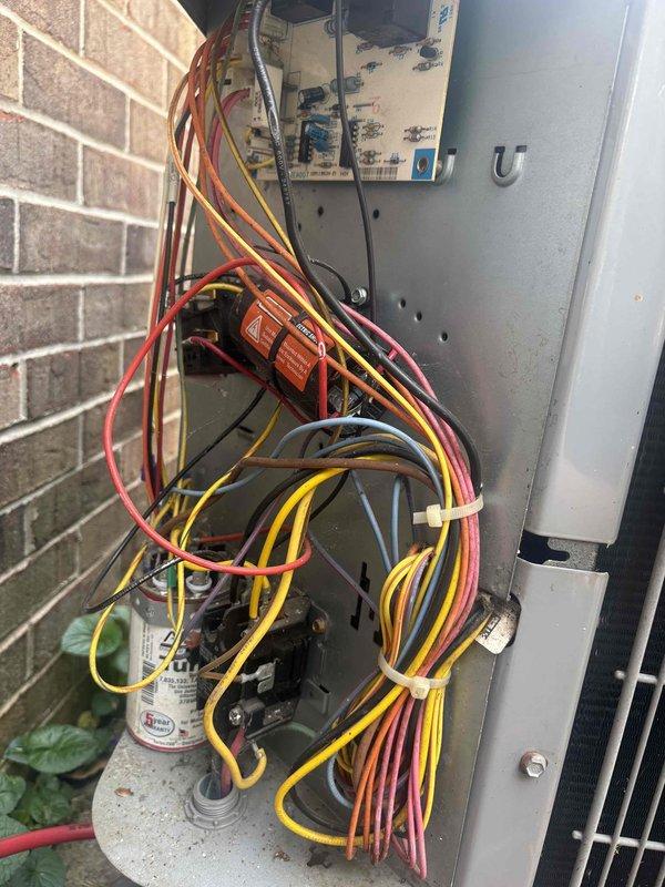 Completed annual care plan maintenance on single-zone HVAC system consisting of one heat pump and one air handler. Performed comprehensive tune-up including inspection of electrical components, contactors, relays, and capacitor at outdoor unit, verified all wire connections and terminals were secure, replaced 16x20x1 air filter at indoor air handler, inspected blower motor and housing, examined refrigerant lines and control wiring harness, and documented equipment condition with photos of electrical panel and furnace interior components.