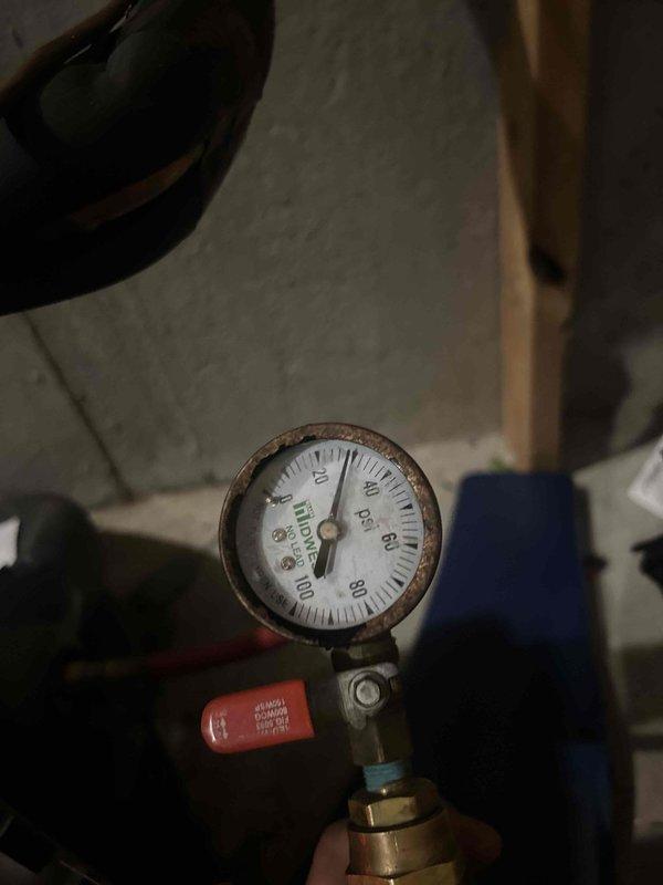 Responded to HVAC service call back for geothermal system with ongoing operational issues. Inspected pressure gauges and system components, documented current readings and equipment condition showing signs of age and corrosion. Scheduled follow-up visit with WaterFurnace AID diagnostic tool to perform comprehensive system analysis, review all settings, and retrieve fault history to diagnose and resolve persistent system failures.