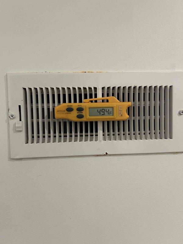 Responded to no cooling call on 5-year-old air conditioning system with thermostat displaying "waiting" status and failing to activate. Performed diagnostic evaluation and confirmed thermostat was receiving power and properly configured in cooling mode, verified system communication and airflow at supply register with temperature readings, and restored normal cooling operation. System tested and operating within normal parameters upon departure.