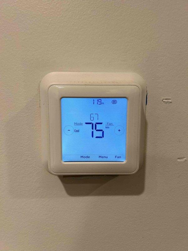 Responded to no cooling call on 5-year-old air conditioning system with thermostat displaying "waiting" status and failing to activate. Performed diagnostic evaluation and confirmed thermostat was receiving power and properly configured in cooling mode, verified system communication and airflow at supply register with temperature readings, and restored normal cooling operation. System tested and operating within normal parameters upon departure.
