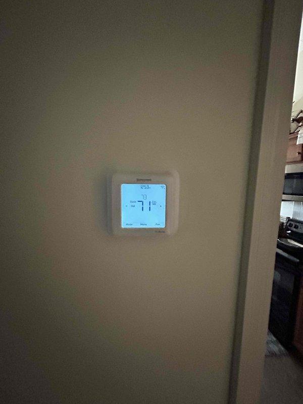 Completed routine HVAC maintenance tune-up on residential system with air conditioning and gas furnace unit located in attic. Performed standard system diagnostics using infrared temperature measurement tools, verified thermostat operation showing 71°F set point, and conducted comprehensive inspection of equipment in accordance with preventative maintenance protocol using customer-supplied filter X6673.