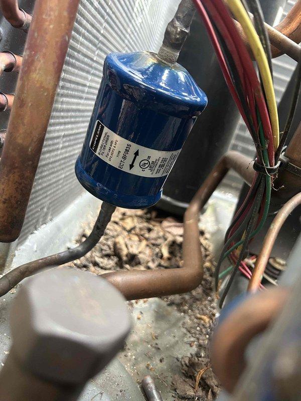 Performed evaporator coil replacement on residential HVAC system. Accessed unit with assistance from neighbor as arranged. Removed failed evaporator coil and installed new replacement unit. Evacuated system using vacuum pump to proper micron levels, verified with wireless vacuum gauge showing acceptable readings. Recharged system with 17 pounds of R410A refrigerant to manufacturer specifications. Inspected capacitor, copper line connections, and condenser coil during service. Tested system operation and confirmed proper cooling performance upon completion. Total service time was 5 hours.