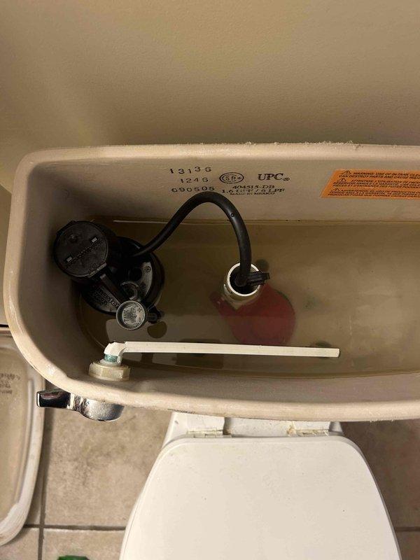 Responded to service call for guest bathroom toilet experiencing slow flush, weak flushing action, and slow tank refill. Upon arrival, performed visual inspection of toilet operation and confirmed inadequate flush performance. Removed tank lid and inspected internal flush mechanism components.

Identified deteriorated flapper valve with visible wear and discolored tank water indicating potential sediment buildup or component degradation. Float mechanism and fill valve examined for proper operation. Flush lever and chain connection assessed for appropriate tension and positioning. Overflow tube and tank interior inspected for mineral deposits or obstructions affecting water flow.

Diagnosed primary issue as compromised flapper valve seal causing incomplete flush cycles and reduced bowl clearing capacity. Secondary factor identified as potential fill valve inefficiency contributing to extended refill times. Documented tank component conditions including manufacturer markings and existing