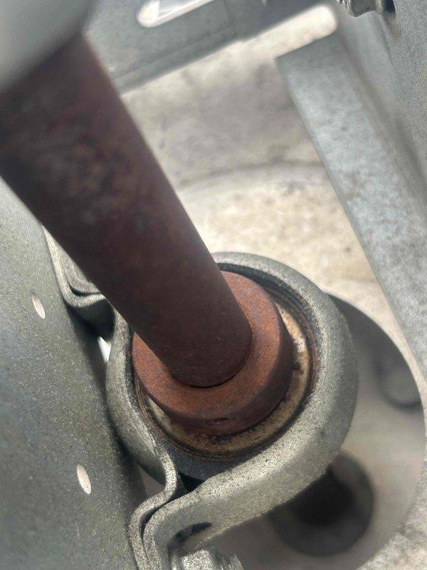 Responded to no cooling complaint on commercial HVAC system with reported inadequate exhaust airflow. Upon inspection, found exhaust motor shaft exhibiting severe rust and corrosion causing binding and reduced rotation speed. Verified ventilation grilles were properly secured but airflow was significantly restricted due to failed motor bearing assembly. Documented equipment condition with photos showing corroded shaft and ventilation components. Recommended immediate motor replacement to restore proper exhaust function and prevent complete system failure.