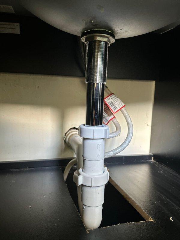 Completed return visit to address leaking Delta shower cartridge and install new lavatory sink strainer. Replaced faulty shower cartridge to eliminate leak. Installed chrome-plated lavatory strainer assembly with new tailpiece connection to existing P-trap configuration under bathroom sink. Verified proper drainage and tested all connections for leaks. Both repairs completed successfully.