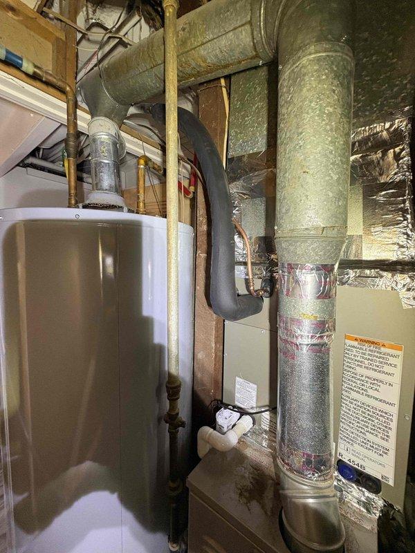 Completed full residential HVAC system installation including Bryant 2-ton 14.3 SEER2 air conditioning unit (model GA5SAN52400W) and matching Bryant 2-ton evaporator coil (model CVAMA2517XMA). Installed condensate pump, outdoor unit pad, electrical whip kit, and electrical disconnect box. Corrected and re-insulated copper line set on exterior wall, installed refrigerant line filter drier, and transitioned evaporator coil to existing ductwork. Integrated SS2 coil drain safety water sensor for overflow protection. Utilized existing thermostat to maintain customer's preferred control system. Removed and properly disposed of old equipment per code requirements. Applied refrigerant line insulation to suction line for optimal efficiency. Tested all system operations including airflow, refrigerant charge, electrical connections, condensate drainage, and safety sensor functionality. System achieved proper temperature differential and operational parameters. All work completed to manufacturer s
