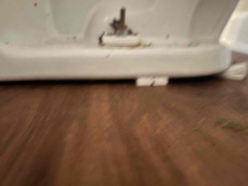 Responded to service call for unstable toilet fixture. Upon inspection, identified loose toilet base connection to floor flange. Removed decorative caps and tightened closet bolts to manufacturer specifications, ensuring proper seal between toilet base and wax ring. Verified fixture stability and tested for proper operation and water flow. Toilet now secure with no movement or rocking.