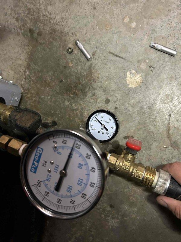 Replaced failed circulator pump on GEOLINK dual-pump flow center serving geothermal heating system. Performed pressure testing of system components using calibrated gauges to verify proper operating pressures and confirm system integrity after pump replacement.