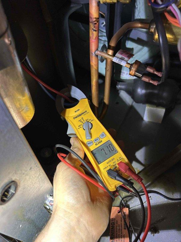 Completed annual maintenance tune-up on geothermal HVAC system with one ground loop and humidifier located in basement. Performed comprehensive inspection including electrical testing of system components, verified loop pressures on GEOLINK hydronic heating system and dual circulation pumps, inspected ground loop manifold assembly and connections, checked #35 pad and washable filter, and documented system operation with all parameters within normal operating range.