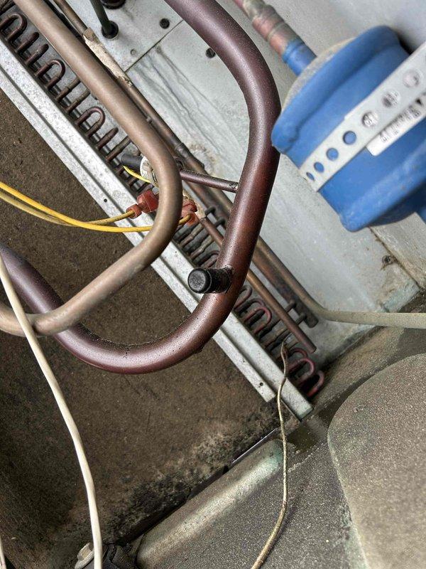 Responded to no cooling complaint on commercial property with multiple roof-mounted electric HVAC units. Performed diagnostic evaluation on underperforming equipment, accessing roof-mounted condensers and evaporator components. Inspected refrigerant lines, pressure sensors, and electrical connections on affected units, documenting system conditions with detailed photography of copper piping assemblies, pressure transducers, and control wiring for further assessment and repair recommendations.