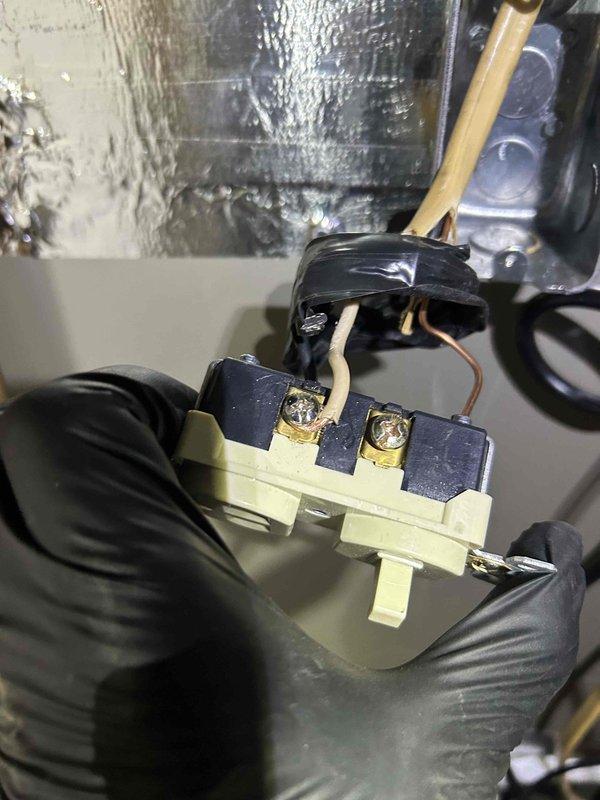 Responded to no-cooling call on newly installed air conditioning system. Upon arrival, unit would not power on. Conducted diagnostic inspection and discovered severe electrical failure at terminal block connection. Found significant heat damage and arcing at the contactor assembly, with melted plastic housing, charred insulation, and oxidized copper conductors. The terminal block showed evidence of overheating event causing structural failure of connector components. Removed damaged electrical components and replaced faulty contactor and compromised wiring connections. Verified proper wire gauge and secure terminations at all connection points. Restored power to unit and confirmed system operation. Unit now cooling properly with no electrical anomalies detected.