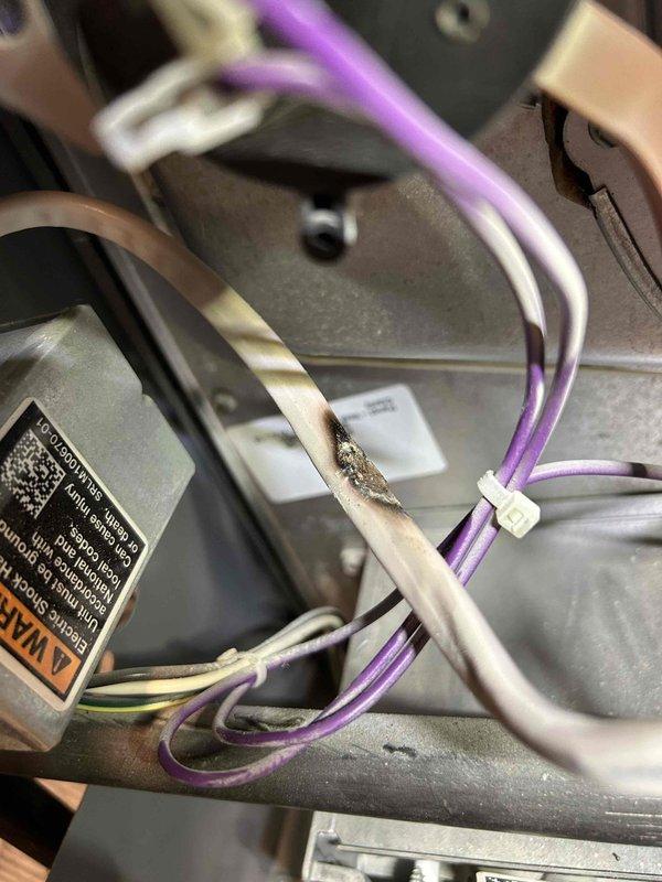 Completed comprehensive tune-up on 1.5-year-old heating equipment located in basement. Performed temperature diagnostics using precision testing equipment, recording operating temperature of 386°F, and conducted thorough inspection of electrical connections and wiring harnesses. Provided consultation regarding potential conversion from current system to gas heating equipment and recommended scheduling follow-up with sales specialist to discuss replacement options.