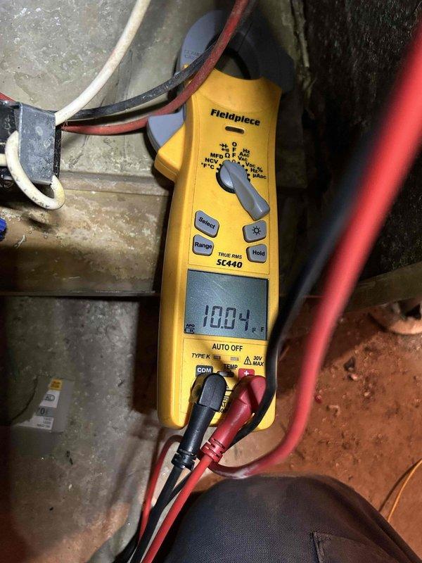 Completed comprehensive Care Plan tune-up on dual HVAC system with air conditioning units and gas furnaces over 10 years old, with equipment located in attic and basement. Performed full system diagnostics using calibrated test equipment, measuring electrical parameters including voltage readings of 100.4V and amperage draw of 6.79A to verify proper operation of both units. Conducted thorough inspection of all accessible components, checked refrigerant pressures, tested electrical connections, evaluated blower motor performance, and verified proper system cycling on both heating and cooling equipment to ensure optimal performance and efficiency.