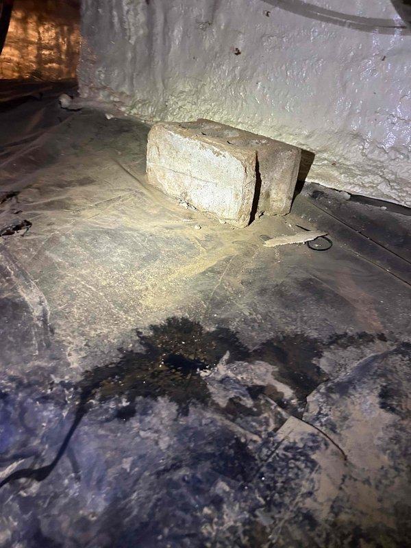 Responded to emergency call for leaking waterline in crawl space that had previously been repaired but was damaged during recent generator installation by another contractor. Upon inspection, located the compromised copper waterline running through the crawl space joists. The line showed evidence of physical impact and active leakage at the damaged section. Shut off water supply to the affected line, cut out the damaged portion of copper pipe, and installed new copper pipe section with proper fittings and soldered joints. Applied pipe clamps for additional reinforcement at the repair points. Tested the repaired waterline under full pressure to verify complete seal with no leaks detected. Cleaned work area and removed all debris from crawl space. System restored to full operational status.