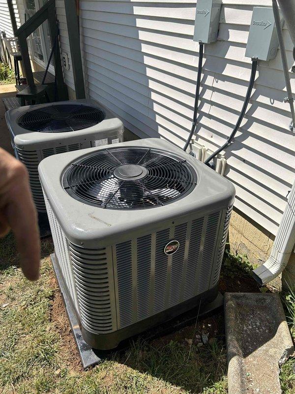 Completed full residential HVAC system installation for first floor consisting of RUUD 2-ton 14.3 SEER2 two-stage heat pump (model RP14AY24AJ2NA), RUUD 2-ton air handler (model RH2TY2417STANNJ), and RUUD 10KW heat kit (model RXBH-1724A10J-B) with digital thermostat. Outdoor heat pump unit installed on concrete pad in backyard with electrical disconnect box mounted on exterior wall, electrical whip kit, refrigerant line insulation, refrigerant line filter, and snow legs for elevated installation. Indoor air handler installation included transition to existing ductwork, standard-sized air filter rack, trap, SS2 coil drain safety water sensor, and ceiling saver overflow drain pan with water sensor for secondary drain protection. Removed and properly disposed of existing equipment per code requirements. Obtained all applicable permits and completed electrical connections including conduit runs from disconnect boxes to outdoor units. System tested and verified operational with proper refrig