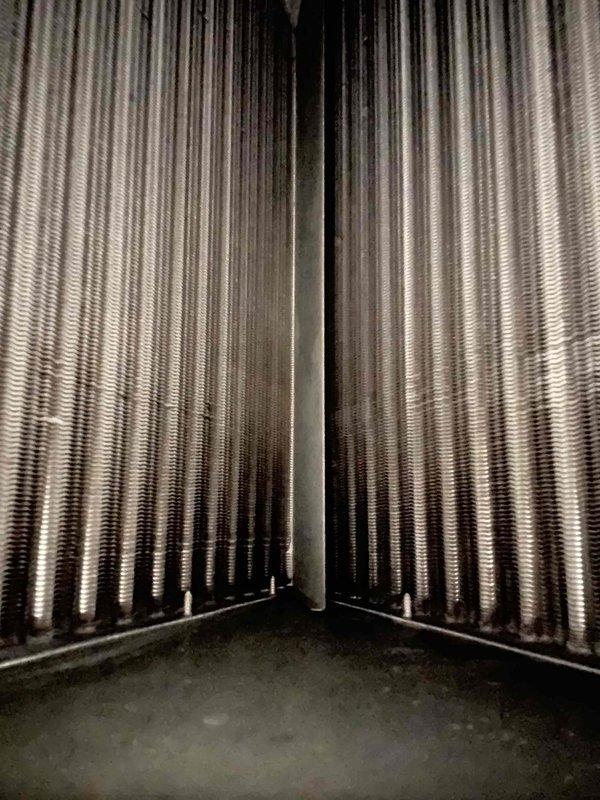 # HVAC Service Call - No Cooling with System Freeze-Up

Responded to a no cooling complaint on a 5-year-old electric Concord air handler system located in the garage. Customer reported the unit had been freezing up for two days and would only blow air after shutting down to thaw. Upon arrival, the system was already thawed out.

Performed visual inspection of the Concord air handler unit and surrounding installation. Examined the indoor air handler cabinet, ductwork connections, condensate drainage system, and accessible refrigerant lines. Inspected flexible ductwork at the supply plenum and verified proper connection to the distribution system. Checked PVC condensate drain lines and tubing for proper pitch and drainage.

Documented equipment condition through photographs showing the air handler installation, manufacturer labels, specification plates, and wiring diagrams affixed to the unit cabinet. Noted the system appeared clean and well-maintained with no obvious signs of physical d