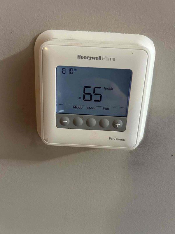Completed Gold Care Plan Tune Up on residential HVAC system. Performed comprehensive system diagnostics including electrical measurements using clamp meter, which indicated 10.4 amp draw on compressor circuit. Inspected all major components including capacitor, wiring connections, and control board—all found to be in proper working condition. Verified thermostat operation and confirmed system settings with unit in off mode and fan set to auto at 65 degrees.