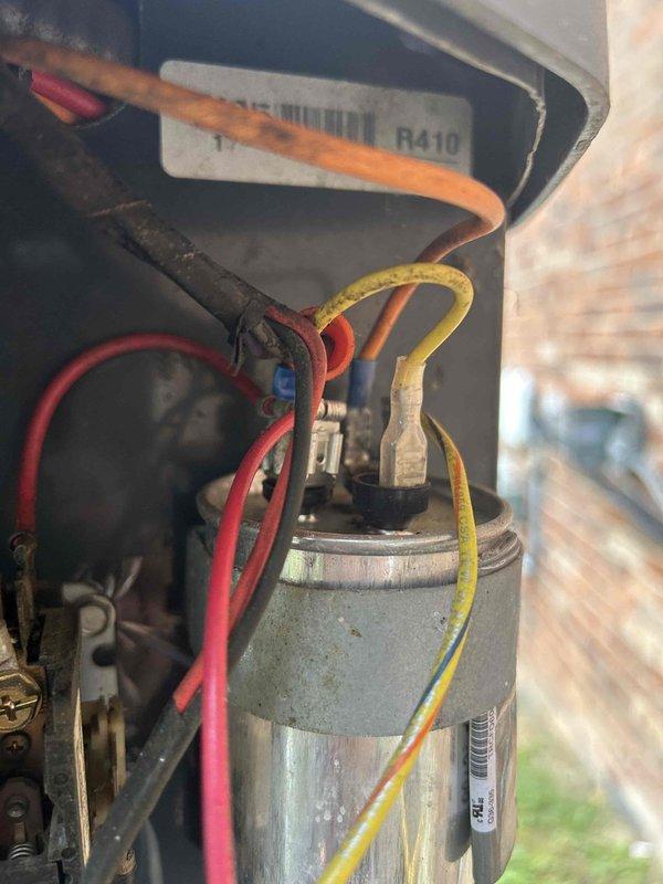 Completed annual care plan maintenance on air conditioning and gas furnace system located in basement. Performed comprehensive inspection of electrical components including capacitor testing, which measured 252 microfarads and showed normal operation. Verified R410A refrigerant specifications and assessed overall system condition, noting typical wear and dirt accumulation on outdoor unit components consistent with normal environmental exposure.