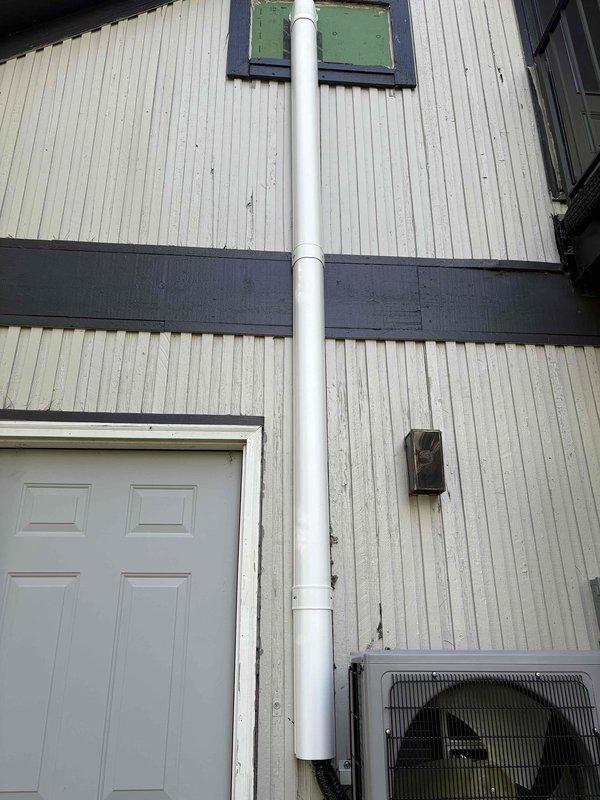 Completed installation of line hide system for new mini split unit at residential property. Concealed refrigerant line set, control wiring, and condensate drain line along exterior wall from outdoor condenser unit to building penetration point. Secured all piping and electrical conduit to exterior siding using appropriate mounting brackets, ensuring professional appearance and protection of components from weather exposure.