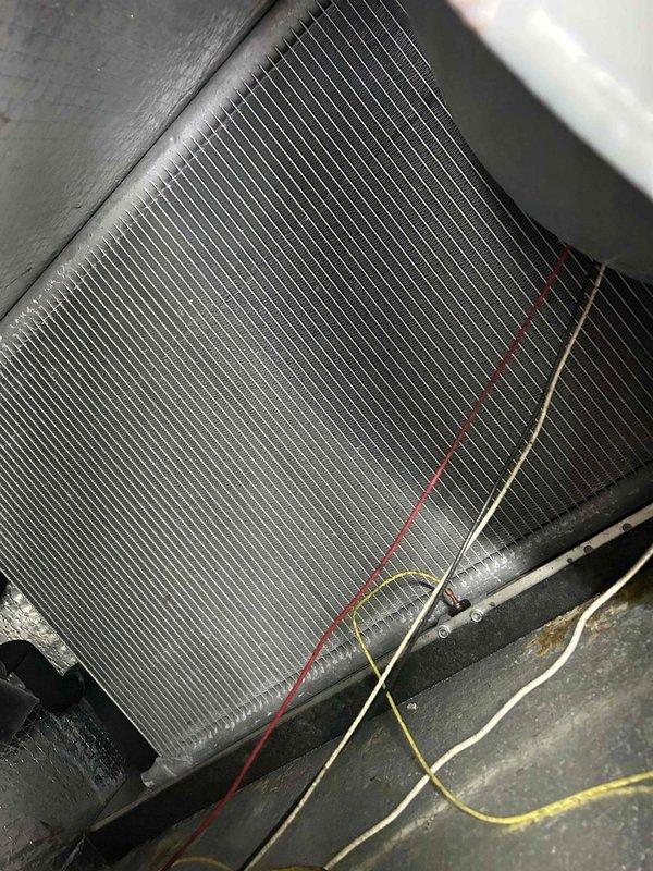Completed Care Plan Tune Up on geothermal HVAC system with indoor unit located in crawlspace. Performed comprehensive maintenance inspection and filter replacement using 18x20x2 and 20x24x2 filters as part of fall service protocol. Inspected and evaluated recently added crawlspace dehumidifier unit, which is elevated on plastic stand supports with condensate pump connection. Examined evaporator coil condition, verified proper fin alignment and cleanliness, and checked electrical connections. All wiring connections were secure with proper color coding observed. Provided estimate for dryer vent cleaning service as requested for future scheduling.