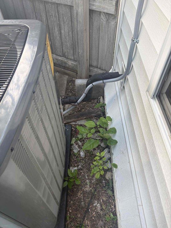 Completed full HVAC system replacement under Daikin warranty, including heat pump condenser unit, air handler, and heat kit installation. Removed existing failed equipment and installed new warranty replacement units in exterior side yard location. Documented all model and serial numbers of both old and new equipment with labeled photographs per warranty claim requirements for manufacturer processing.