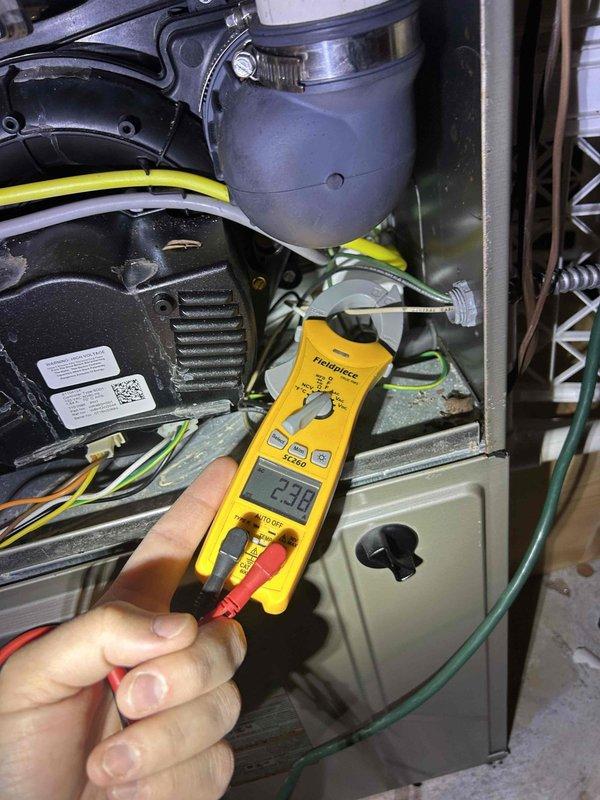 Performed comprehensive Care Plan tune-up on three gas furnace/air conditioning systems located in basement and closet. Conducted electrical diagnostics using digital multimeter to verify proper amperage readings on blower motors and system components. Inspected and tested all three HVAC units including motors, blowers, and air handler assemblies. Verified thermostat operation and programming on Bryant control unit, confirmed system responding properly in fan-only mode with accurate temperature readings. All systems operational and running within manufacturer specifications upon completion of maintenance service.
