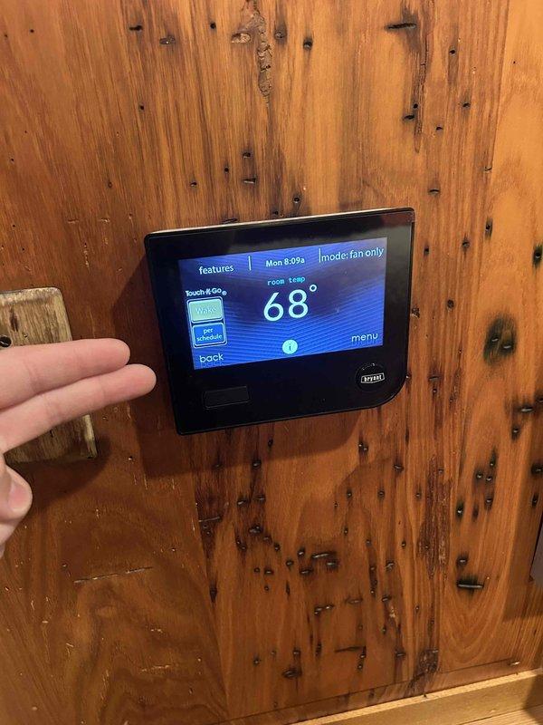 Performed comprehensive Care Plan tune-up on three gas furnace/air conditioning systems located in basement and closet. Conducted electrical diagnostics using digital multimeter to verify proper amperage readings on blower motors and system components. Inspected and tested all three HVAC units including motors, blowers, and air handler assemblies. Verified thermostat operation and programming on Bryant control unit, confirmed system responding properly in fan-only mode with accurate temperature readings. All systems operational and running within manufacturer specifications upon completion of maintenance service.