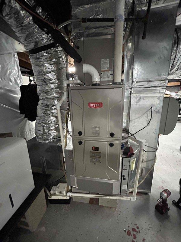 Completed annual Care Plan tune-up on Bryant gas furnace and air conditioning system located in basement as part of first-year maintenance included with new furnace installation. Performed comprehensive system inspection, took diagnostic measurements with testing equipment, verified proper operation of all components, and documented equipment condition with photos. Customer provided 20x25x1 filter for replacement during service visit.