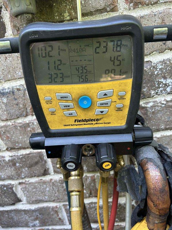 Responded to callback for HVAC system not operating following previous repairs completed on 4/27. Upon arrival, connected refrigerant manifold gauges to service ports and obtained system pressure readings. High-side pressure measured 237.8 PSIG while low-side pressure read 112 PSIG. Noted visible corrosion on copper refrigerant lines indicating potential long-term moisture exposure. Measured supply air temperature at unit discharge, which registered 66.8°F. Performed diagnostic testing to identify root cause of system failure and documented equipment conditions with photos for service records.