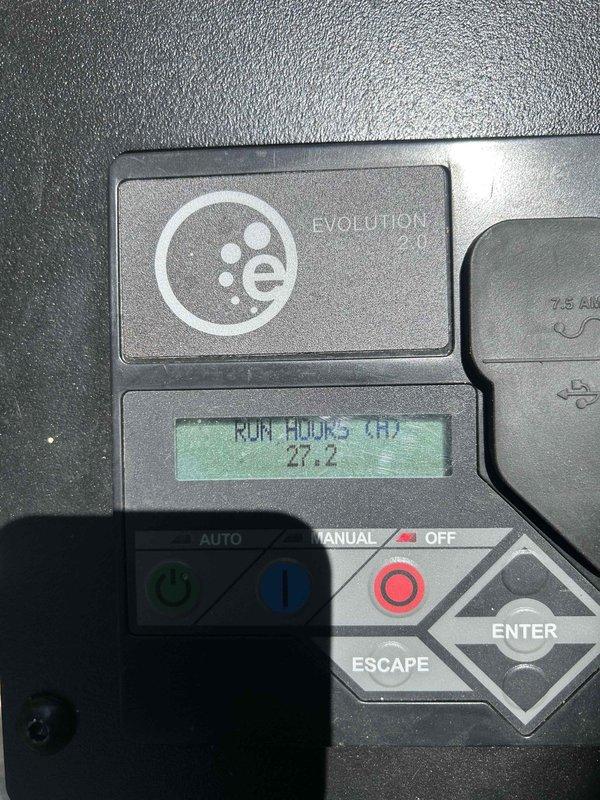Performed routine preventive maintenance on Evolution-branded standby generator unit. Inspected control panel operation, verified AUTO/MANUAL mode functionality, and documented 27.2 limited run hours on digital display. Confirmed unit and exterior components in proper working condition with all controls responding appropriately.
