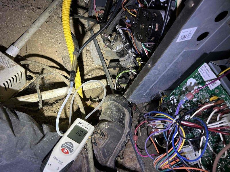 # HVAC Heating System Repair - Control Board Replacement

Responded to a no-heat service call on a 9-year-old furnace with heating and fan operation failure. Upon arrival, performed diagnostic testing of the furnace control system using digital multimeter to isolate the malfunction. Inspection revealed failed integrated furnace control board, which had been previously replaced on this unit.

Disconnected power supply and removed furnace access panels to access the control compartment. Documented existing wiring configuration and connections prior to removal. Disconnected all wire harnesses from the defective control board, including thermostat wiring, blower motor connections, gas valve control circuits, and safety limit switch connections. Removed mounting hardware and extracted failed control board from cabinet.

Installed replacement integrated furnace control board, ensuring proper mounting and secure placement within the control compartment. Reconnected all electrical connections 