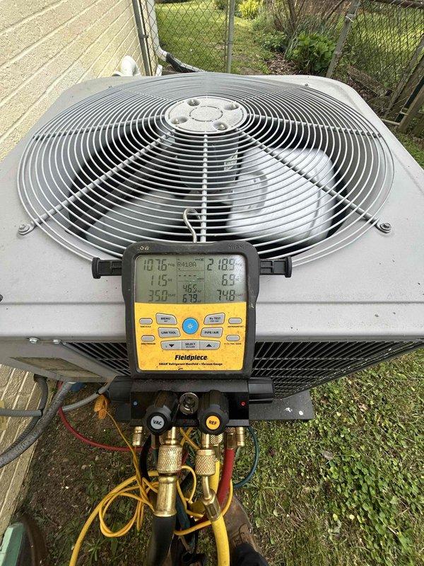 Completed annual maintenance tune-up on residential air conditioning system and gas furnace unit located in crawlspace as part of preventive care plan membership. Performed comprehensive system diagnostics on outdoor condenser unit using calibrated digital manifold gauges to verify refrigerant pressures and temperatures, confirming proper system charge and operational parameters. All components inspected and found operating within manufacturer specifications, with unit cycling properly and maintaining adequate airflow through condenser coils.