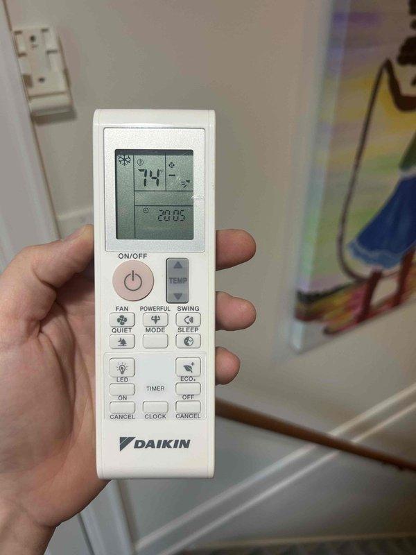 # HVAC Maintenance - Club Duo Completed

Performed comprehensive maintenance service on a Daikin mini-split system located in a downstairs closet. Conducted standard Club Duo preventative maintenance procedures including system inspection, operational testing, and performance verification.

During inspection, identified brownish-orange discoloration and staining on condensate drain assembly components, indicating potential fluid leakage or contamination buildup. Documented condition of drain line connections and metallic valve housing where black rubber hose attaches to system. Noted visible wear on rubber hose exterior with surface scratches and scuff marks, though connection remains secure with metal hose clamp in place. Observed dust accumulation on base pan and surrounding equipment surfaces consistent with normal operational environment.

Verified system operational status using manufacturer remote control. Confirmed unit responding properly to commands with display showing 74°F s