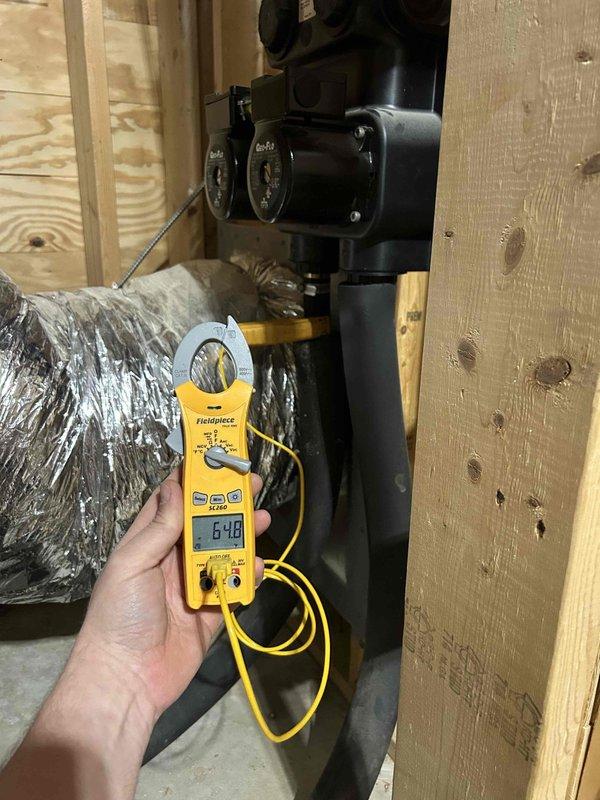 Completed preventive maintenance tune-up on geothermal system located in basement. Performed electrical diagnostics using clamp meter, recording voltage reading of 179.7V at control panel and amp draw of 6.48A at circulation pump. Inspected all system components, wiring connections, and mechanical equipment for proper operation. Customer provided air filters for system as part of care plan service.