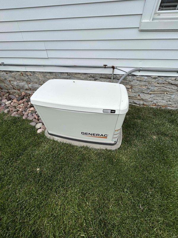 Completed comprehensive preventive maintenance service on Generac Evolution 2.0 air-cooled standby generator with 38.4 run hours. Performed thorough inspection of unit exterior and enclosure, verified physical mounting and location stability. Conducted complete fuel system inspection including lines, connections, and supply verification. Executed full battery load test and charging system analysis to ensure reliable starting capability. Tested all electrical connections on both high and low voltage sides for proper torque and integrity. Replaced spark plugs, air filter, and oil filter as part of scheduled maintenance intervals. Adjusted valve clearances to manufacturer specifications. Performed operational verification testing in both manual and automatic transfer modes under load conditions to confirm proper generator response and output. All systems tested within normal parameters and unit returned to automatic standby mode upon completion.
