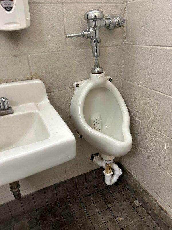 Responded to a commercial restroom facility to address a malfunctioning urinal flush meter and drainage system. Replaced heavily corroded internal components within the flush valve assembly, including the diaphragm, gaskets, and seals that had deteriorated due to extended water exposure and mineral buildup. Rebuilt the urinal drain assembly by removing the existing corroded tailpiece and installing new drain components with proper sealing to ensure leak-free operation. Tested the flush meter for proper activation and water flow, verified drain functionality, and confirmed no leaks at connection points upon completion.